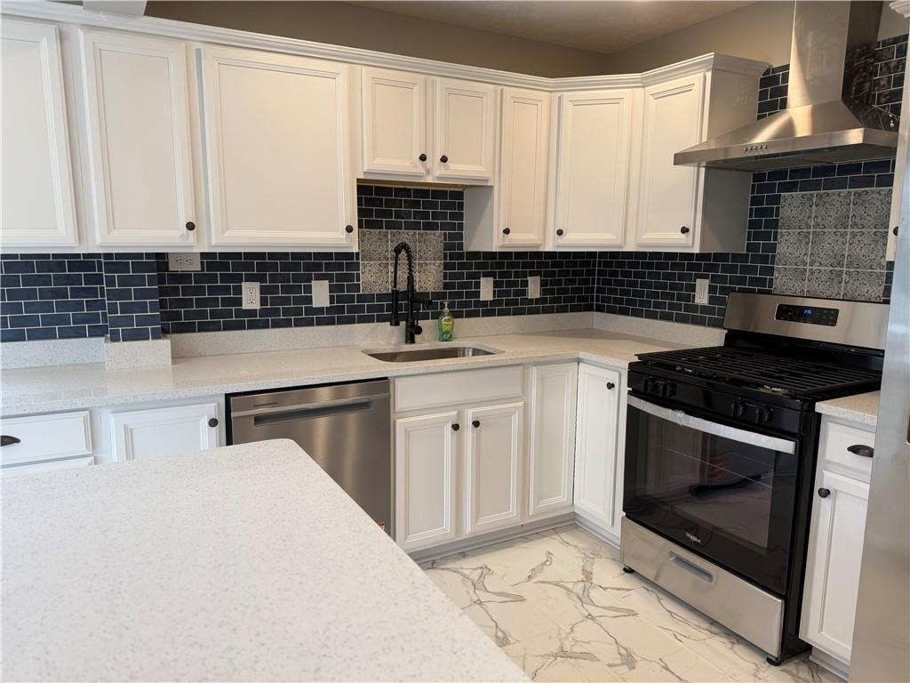 2026 Marshall Road Monaca, PA 15061 - Photo 11 of 30 a kitchen with a sink stove and cabinets