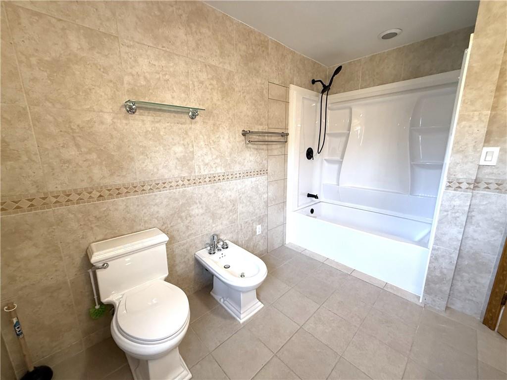 2026 Marshall Road Monaca, PA 15061 - Photo 19 of 30 a white toilet sitting next to a bath tub and a shower