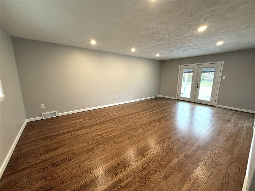 2026 Marshall Road Monaca, PA 15061 - Photo 20 of 30 an empty room with wooden floor and windows