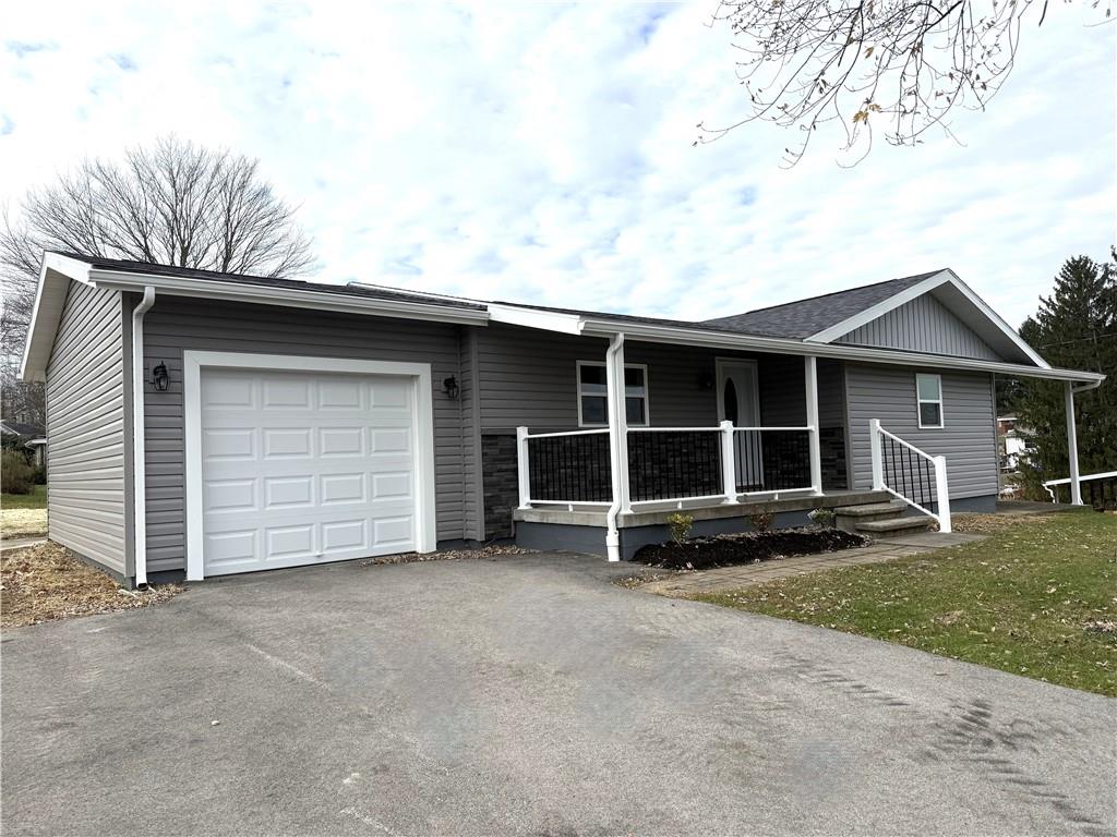 2026 Marshall Road Monaca, PA 15061 - Photo 2 of 30 a view of a house with a yard and garage