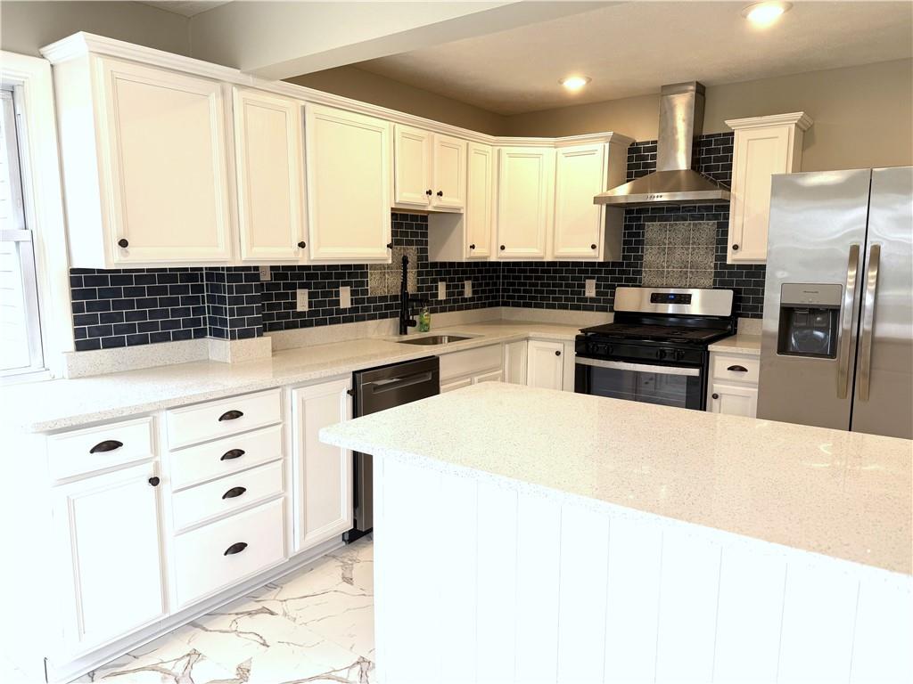 2026 Marshall Road Monaca, PA 15061 - Photo 22 of 30 a kitchen with granite countertop white cabinets and stainless steel appliances