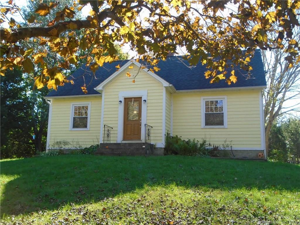 94 Cooktown Road Preston, CT 06365 - Photo 1 of 1 a front view of a house with a garden and yard