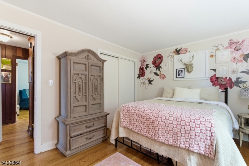 77 Lower North Shore Road Branchville, NJ 07826 - Photo 20 of 38 a bedroom with a bed and a window