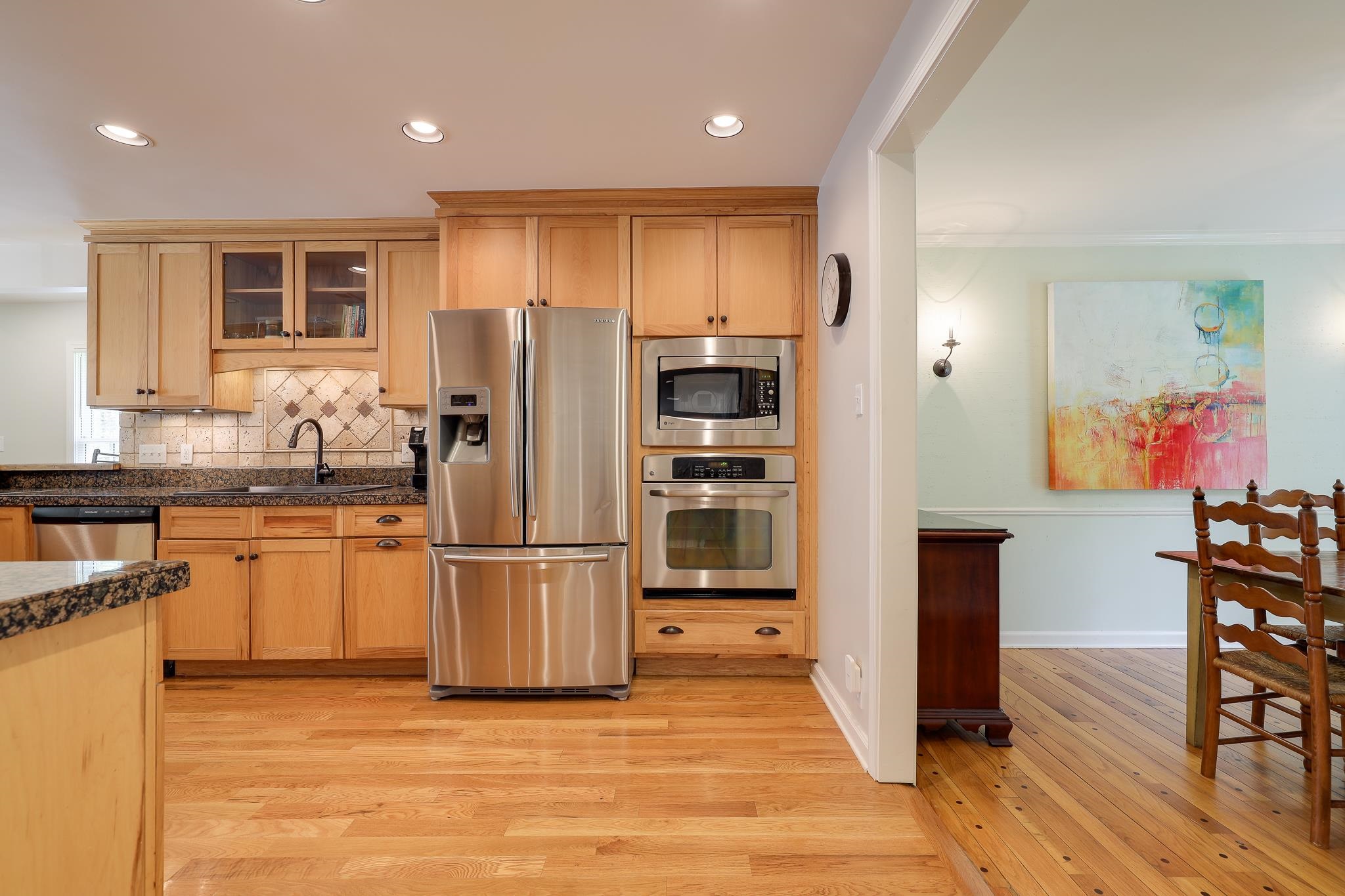 6164 Harwick Drive Memphis, TN 38119 - Photo 12 of 29 a kitchen with stainless steel appliances granite countertop a refrigerator and a stove top oven