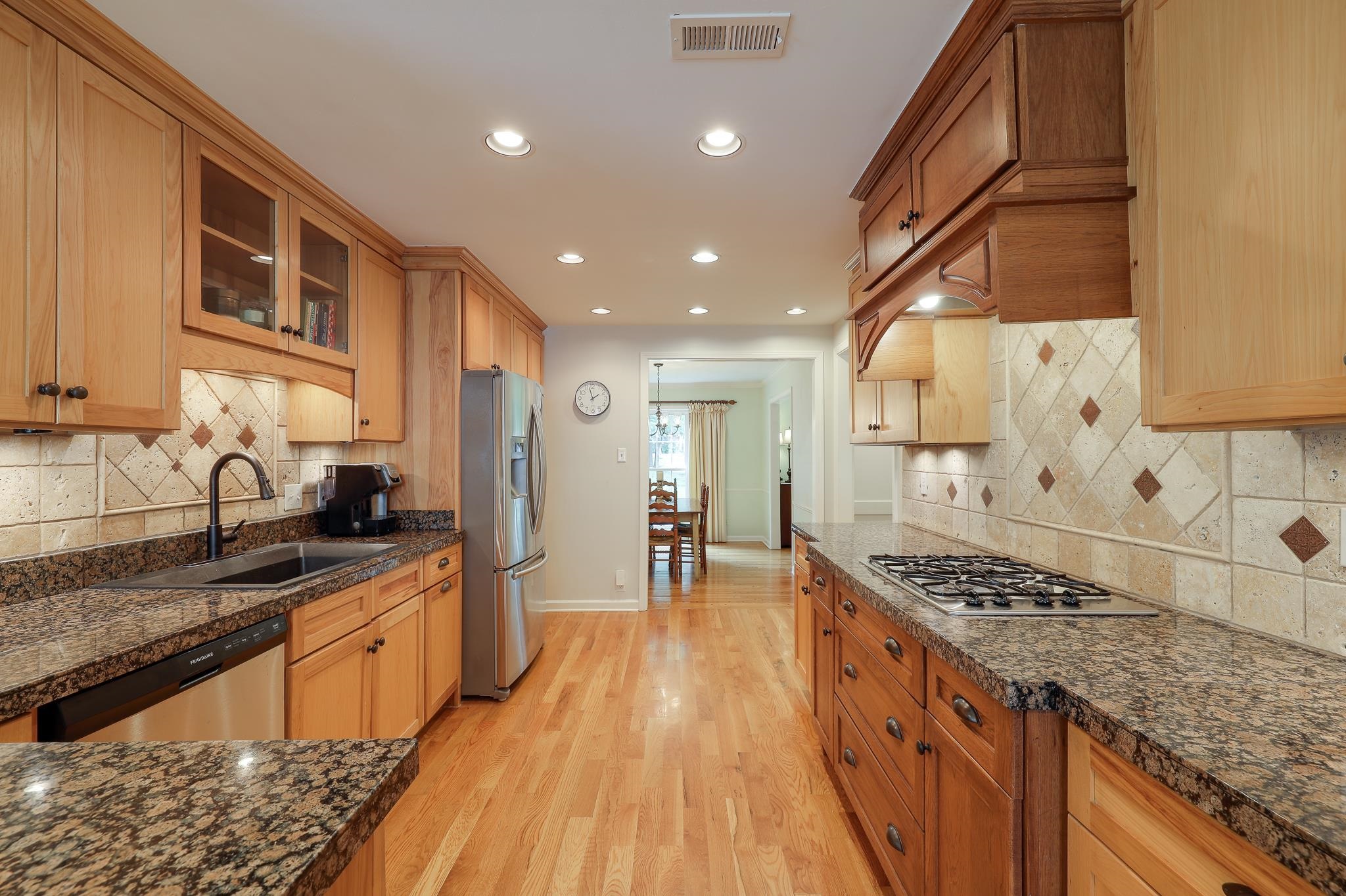 6164 Harwick Drive Memphis, TN 38119 - Photo 14 of 29 a kitchen with stainless steel appliances granite countertop a stove and a sink
