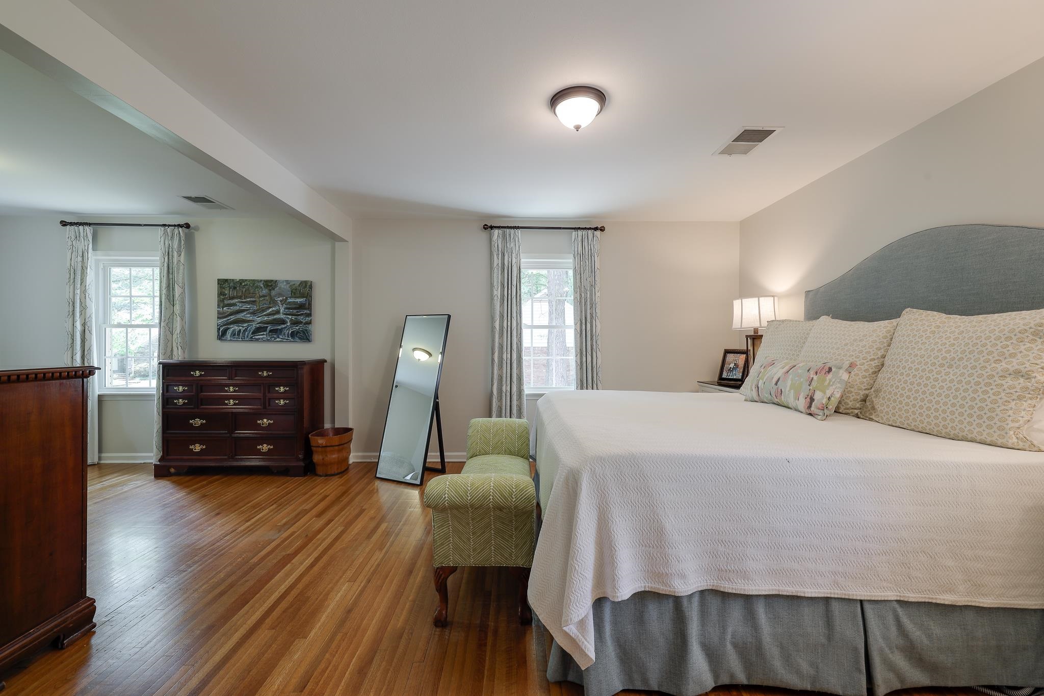 6164 Harwick Drive Memphis, TN 38119 - Photo 18 of 29 a bedroom with a bed and wooden floor