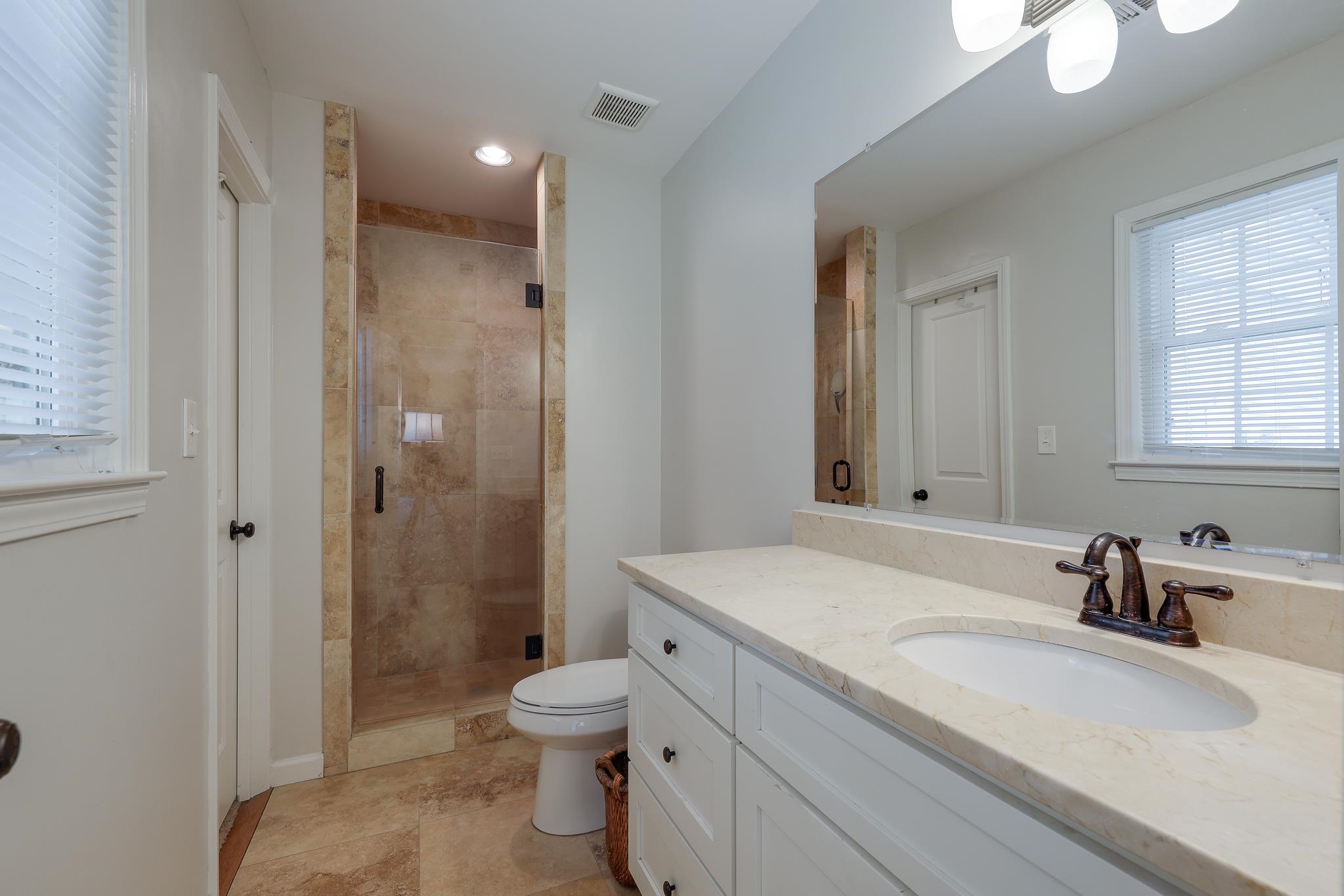 6164 Harwick Drive Memphis, TN 38119 - Photo 19 of 29 a bathroom with a sink toilet vanity and shower