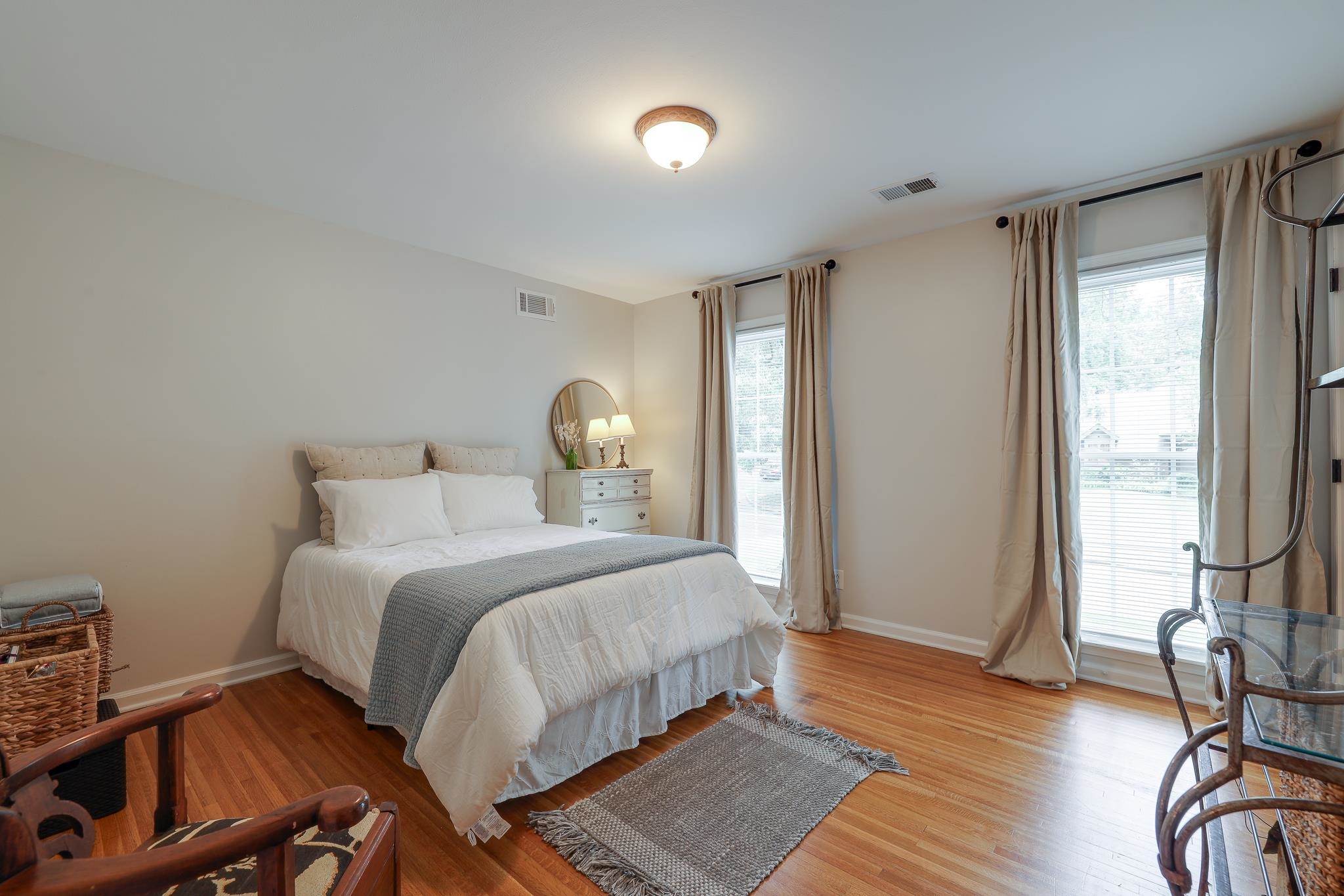 6164 Harwick Drive Memphis, TN 38119 - Photo 20 of 29 a bedroom with a bed and wooden floor