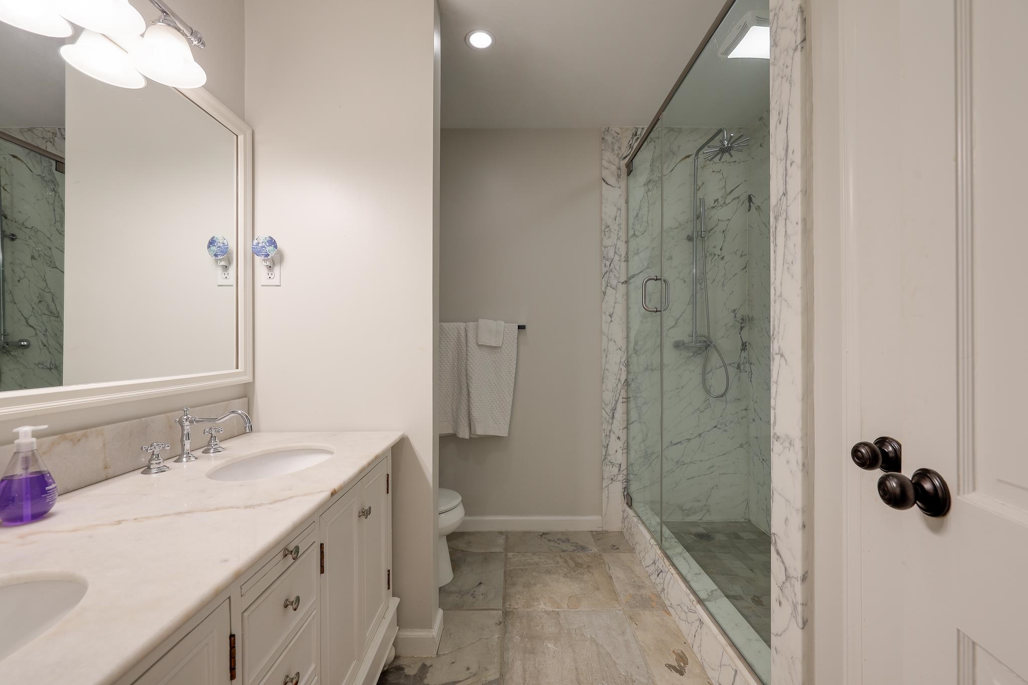 6164 Harwick Drive Memphis, TN 38119 - Photo 26 of 29 a bathroom with a double vanity sink toilet and shower