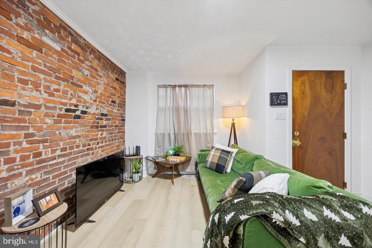 1228 South 2nd Street Philadelphia, PA 19147 - Photo 13 of 35 a bedroom with a bed and a lamp