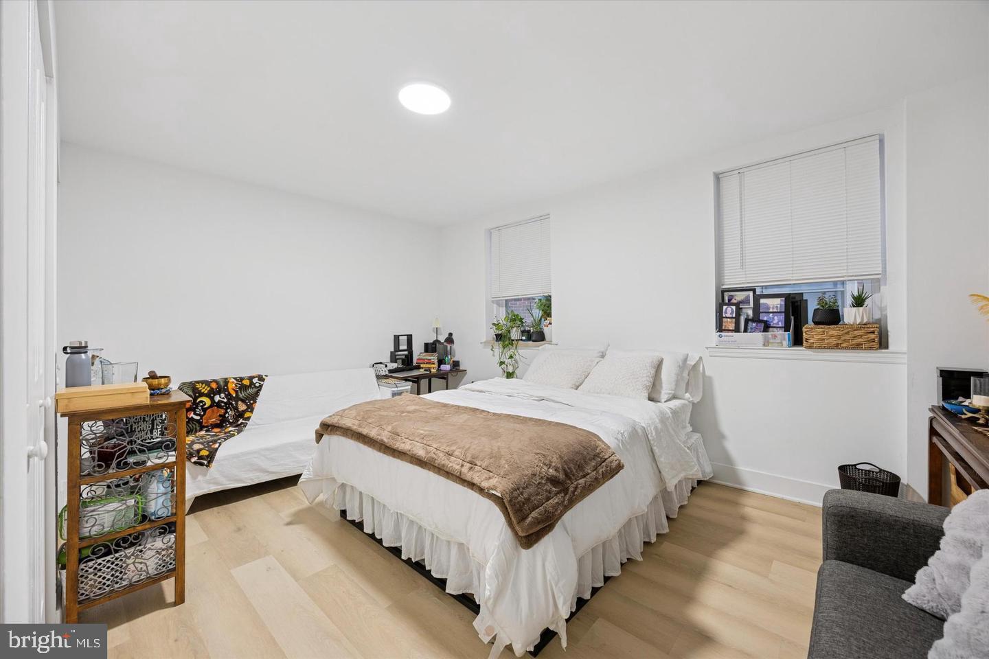 1228 South 2nd Street Philadelphia, PA 19147 - Photo 17 of 35 a spacious bedroom with a bed and a couch