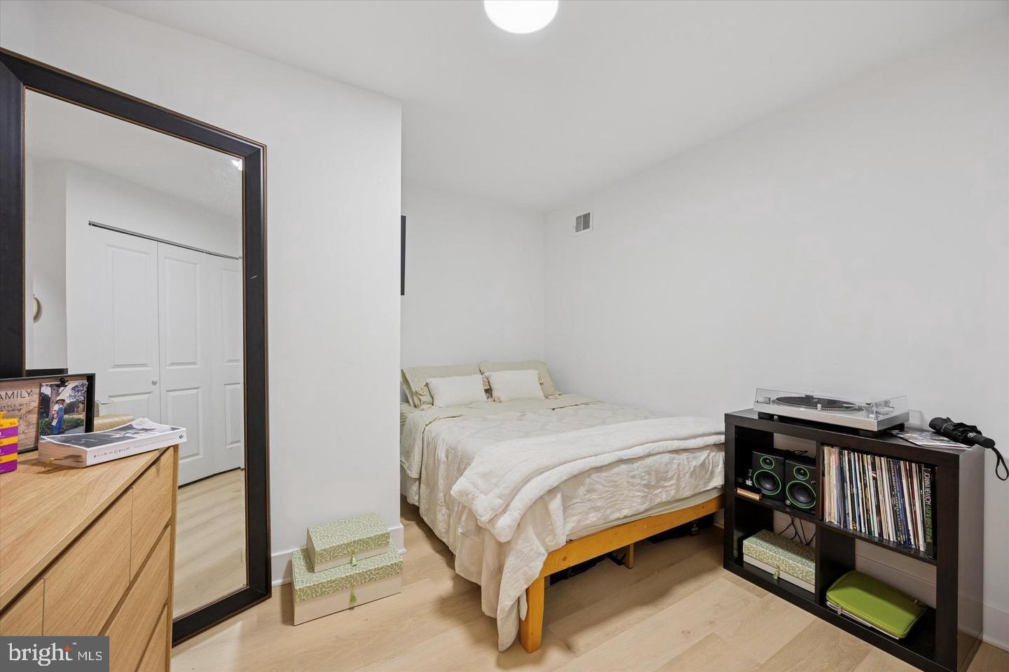 1228 South 2nd Street Philadelphia, PA 19147 - Photo 20 of 35 a bedroom with a bed and a dresser