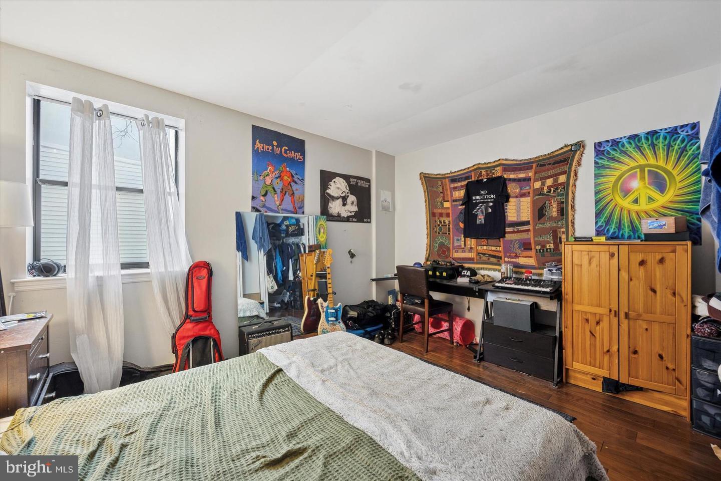 1228 South 2nd Street Philadelphia, PA 19147 - Photo 30 of 35 a bed room with a bed and a flat screen tv