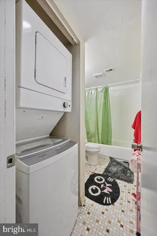 a bathroom with a sink a toilet and a shower