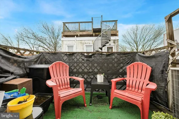 a view of a chairs in patio
