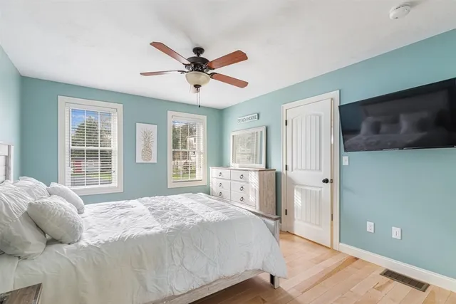 a bedroom with a large bed and a window