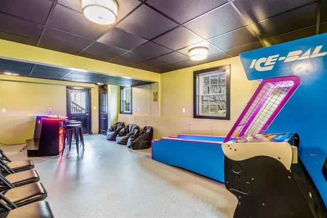 a room with furniture and gym equipment