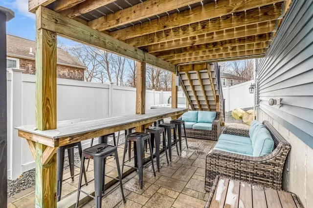 a view of an chairs and table in the balcony