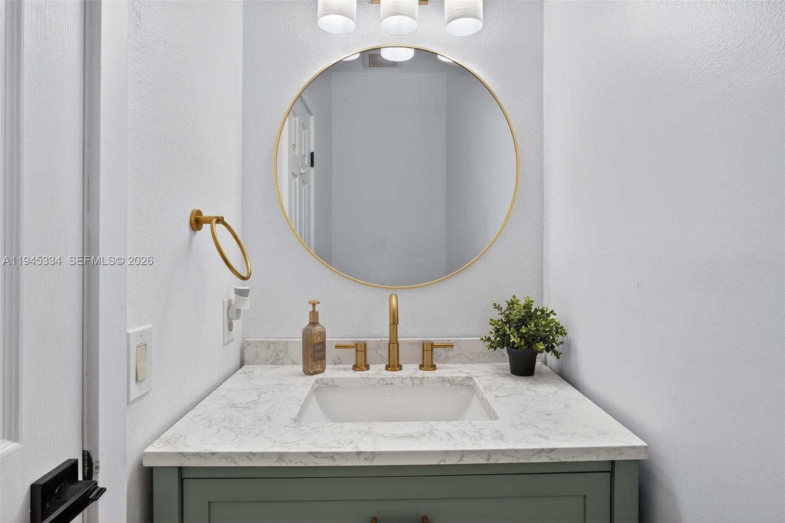 12200 Southwest 100th Street Miami, FL 33186 - Photo 17 of 48 a bathroom with a sink and a mirror