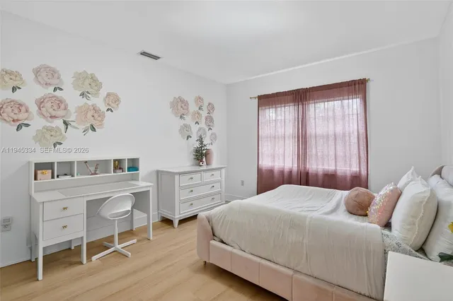 a view of a livingroom with furniture and wooden floor
