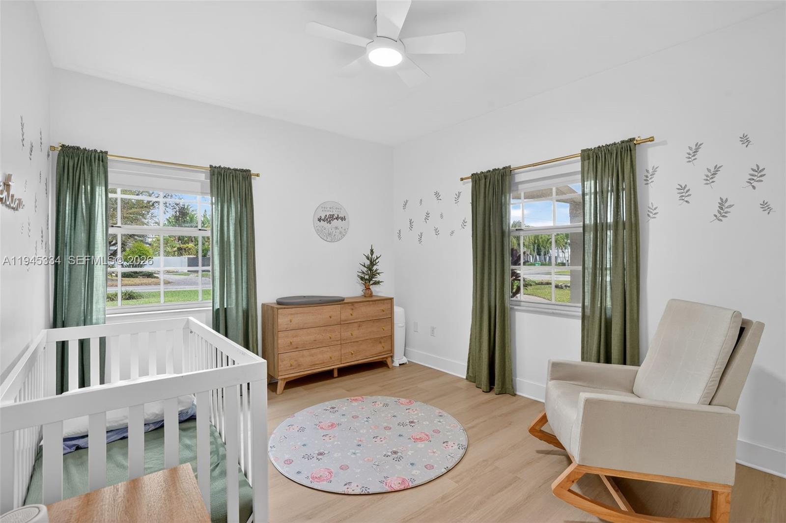 12200 Southwest 100th Street Miami, FL 33186 - Photo 22 of 48 a view of a livingroom with furniture and wooden floor