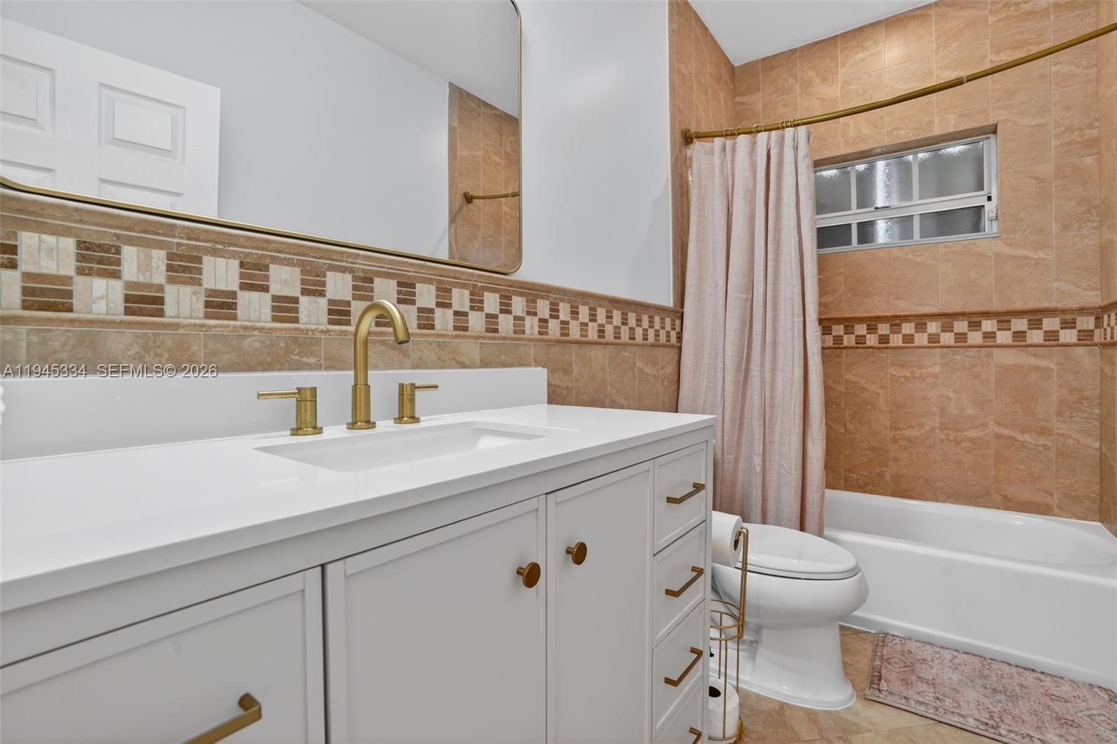 12200 Southwest 100th Street Miami, FL 33186 - Photo 24 of 48 a bathroom with a sink a toilet and a bathtub