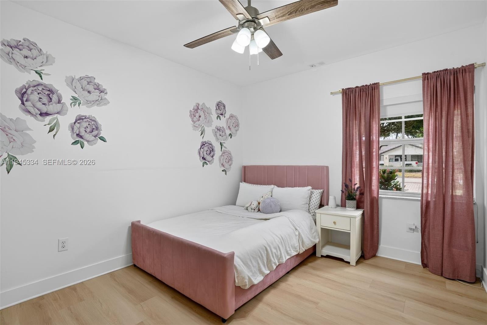 12200 Southwest 100th Street Miami, FL 33186 - Photo 25 of 48 a bedroom with a bed and a window