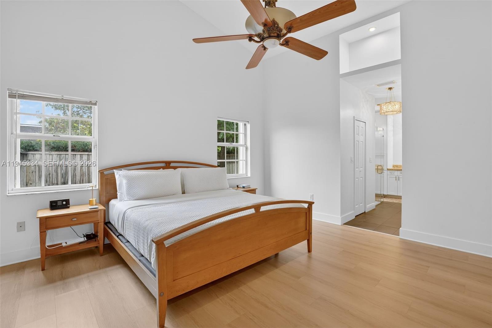 12200 Southwest 100th Street Miami, FL 33186 - Photo 27 of 48 a bedroom with a bed and a window