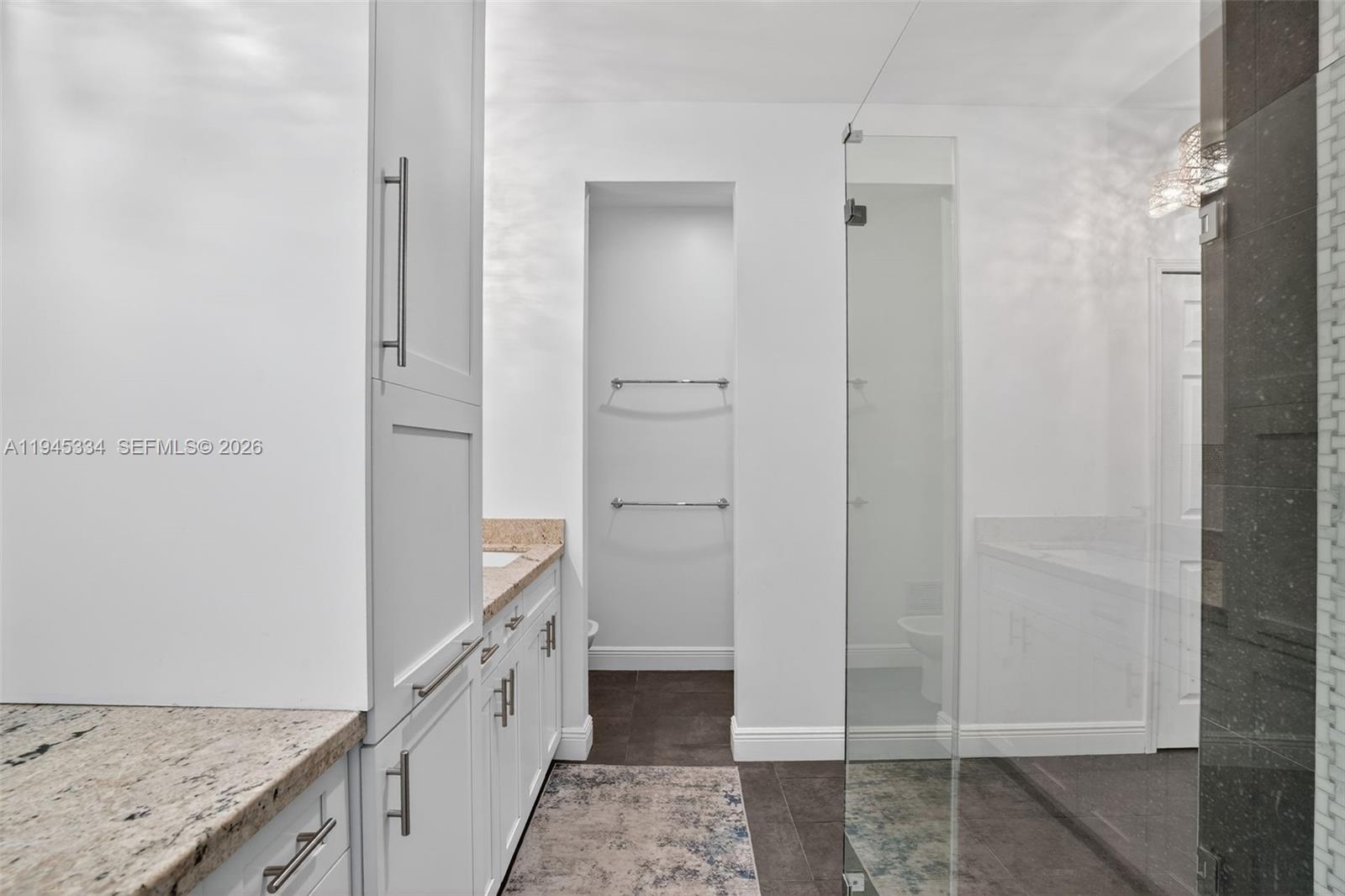 12200 Southwest 100th Street Miami, FL 33186 - Photo 32 of 48 a bathroom with a granite countertop sink and a mirror