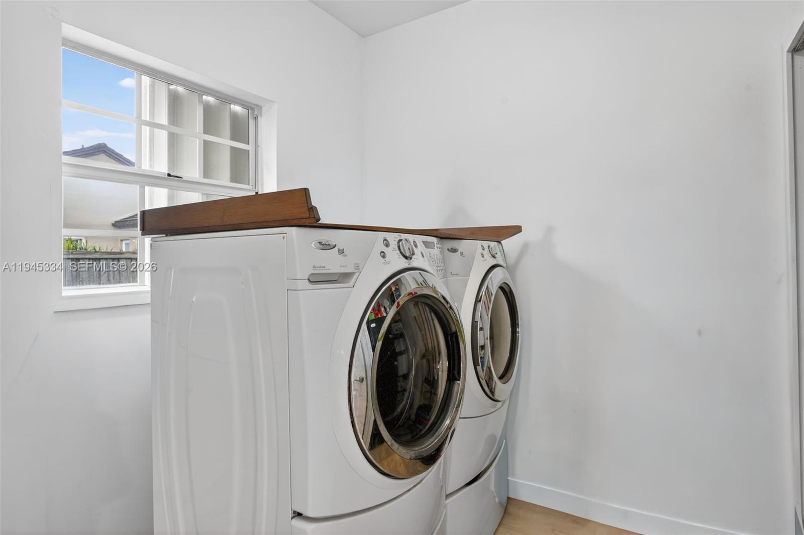12200 Southwest 100th Street Miami, FL 33186 - Photo 33 of 48 a utility room with dryer and washer