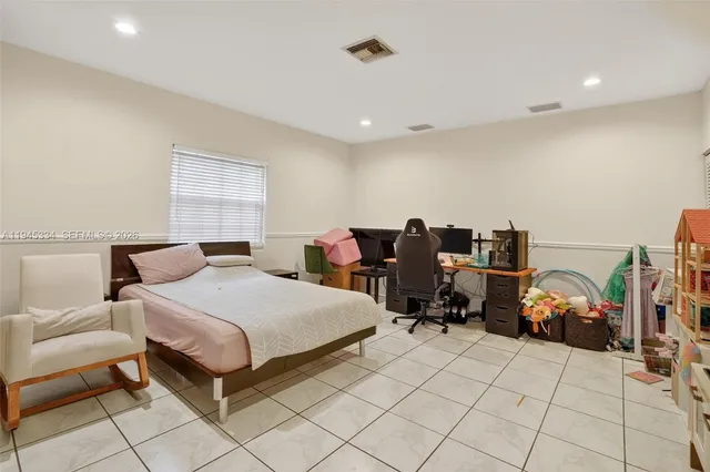 a dining room with a table and chairs