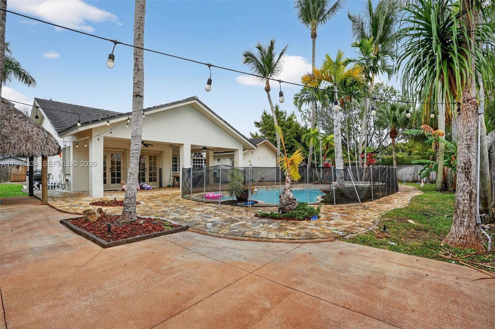 12200 Southwest 100th Street Miami, FL 33186 - Photo 39 of 48 a view of a house with backyard and sitting area