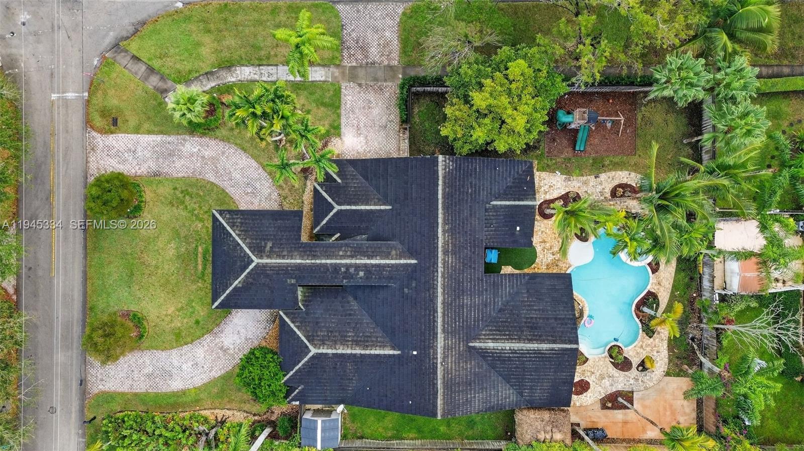 12200 Southwest 100th Street Miami, FL 33186 - Photo 44 of 48 an aerial view of a house with a yard