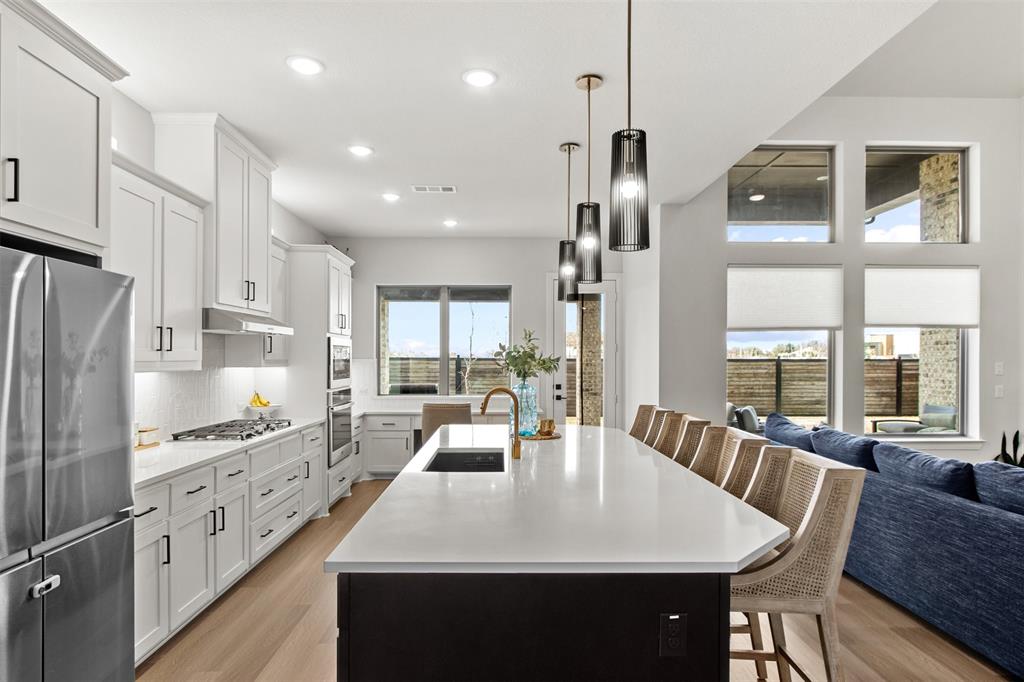 2708 Darlington Road Northlake, TX 76226 - Photo 13 of 40 a large kitchen with kitchen island a large island in it