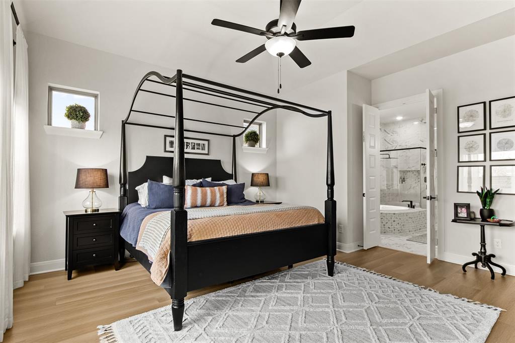 2708 Darlington Road Northlake, TX 76226 - Photo 22 of 40 a bed room with a bed and a chandelier