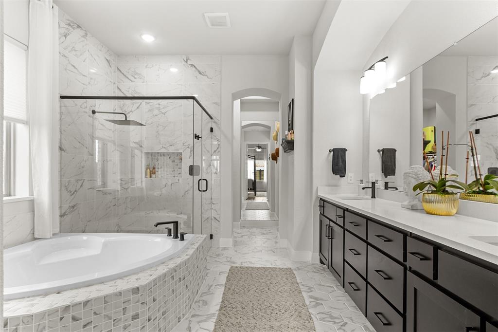2708 Darlington Road Northlake, TX 76226 - Photo 23 of 40 a bathroom with a tub sink double vanity granite and shower