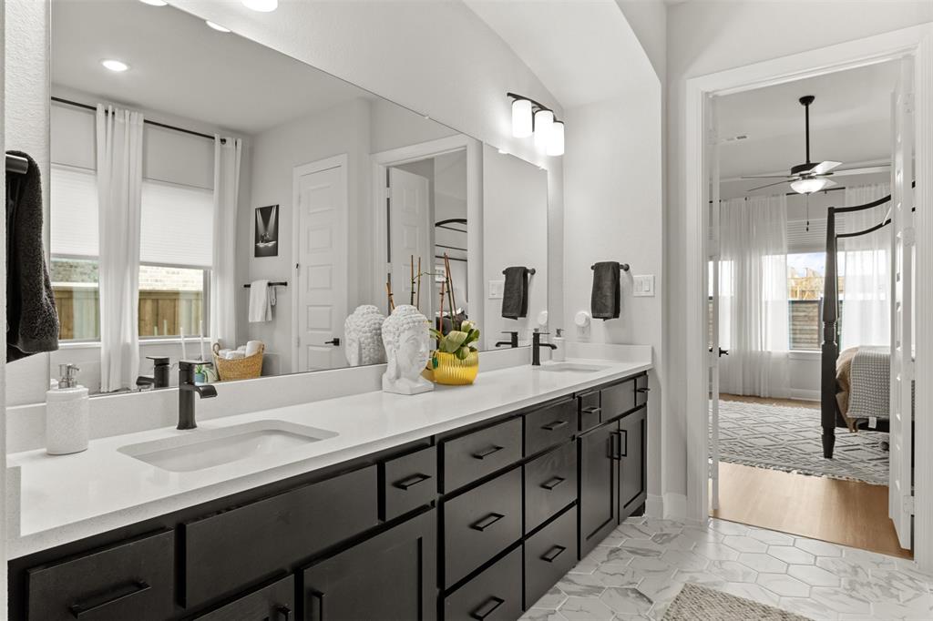 2708 Darlington Road Northlake, TX 76226 - Photo 25 of 40 a bathroom with a tub sink and mirror