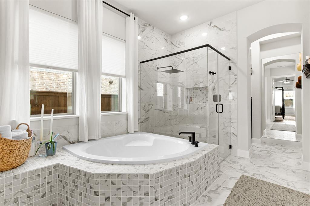 2708 Darlington Road Northlake, TX 76226 - Photo 26 of 40 a bathroom with a granite countertop sink a mirror and shower