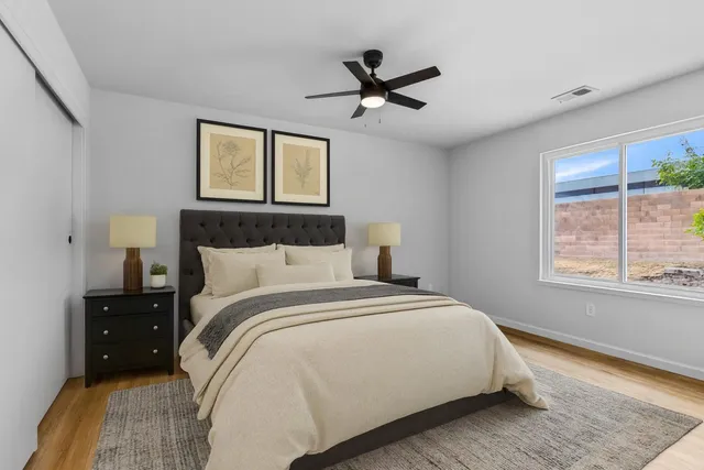 a bedroom with a bed and a window