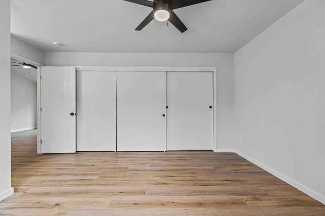 a view of a livingroom with wooden floor