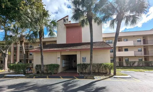 front view of a house with a tree