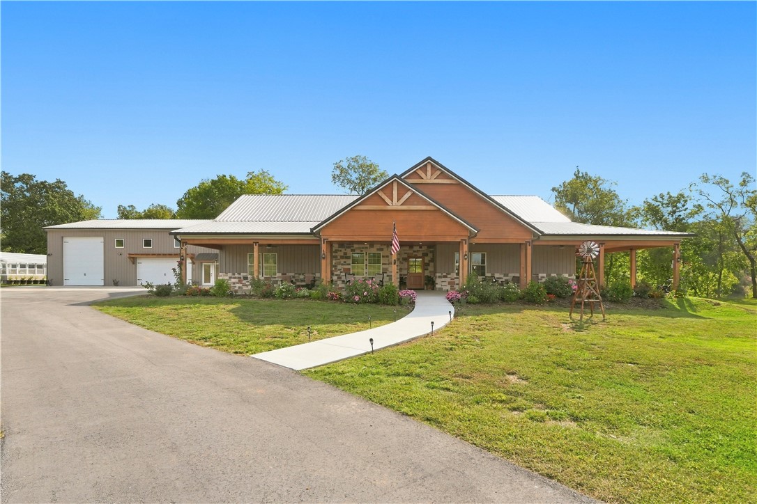 8800 Fred Austin Road Decatur, AR 72722 - Photo 2 of 60 Front of home with huge wrap around patio and beautiful landscaping
