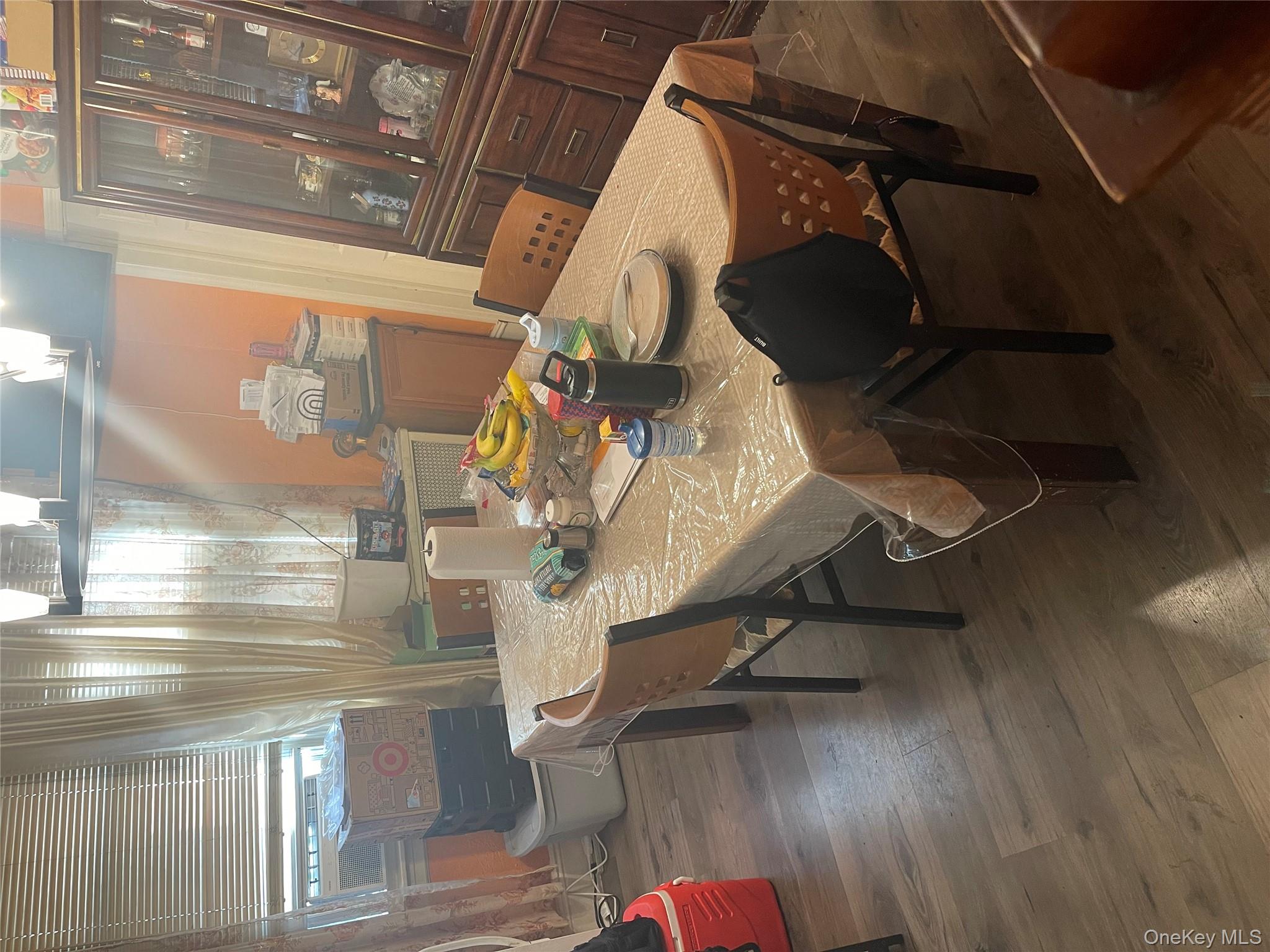 197-13 118th Avenue Queens, NY 11412 - Photo 4 of 5 a dining room with furniture and wooden floor