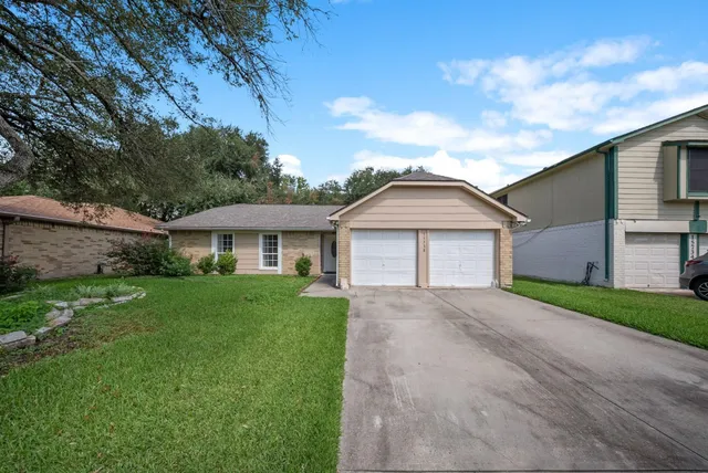 a view of a front of a house with a yard