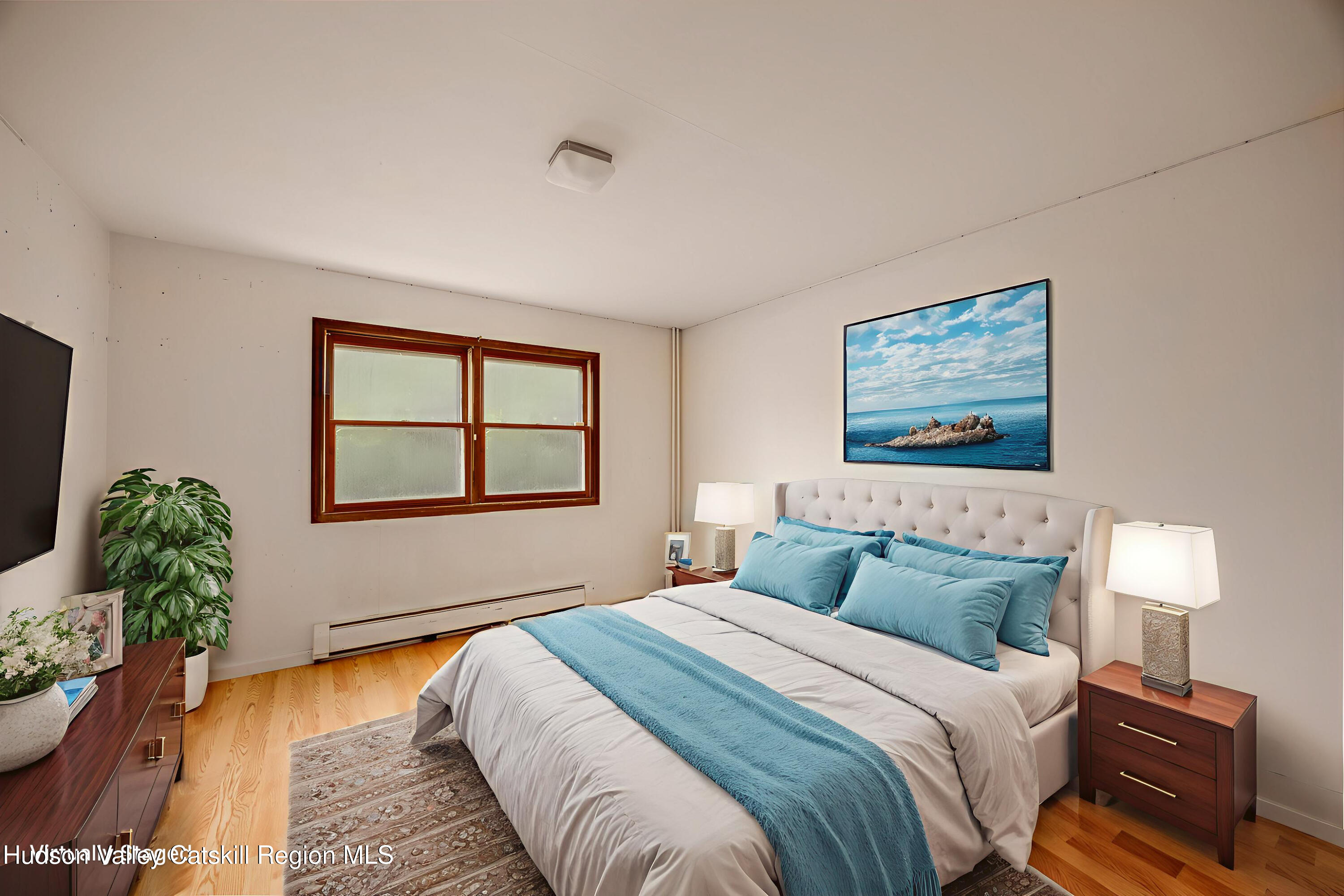 94 Tanglewood Road West Hurley, NY 12491 - Photo 21 of 34 a bedroom with a bed and a window