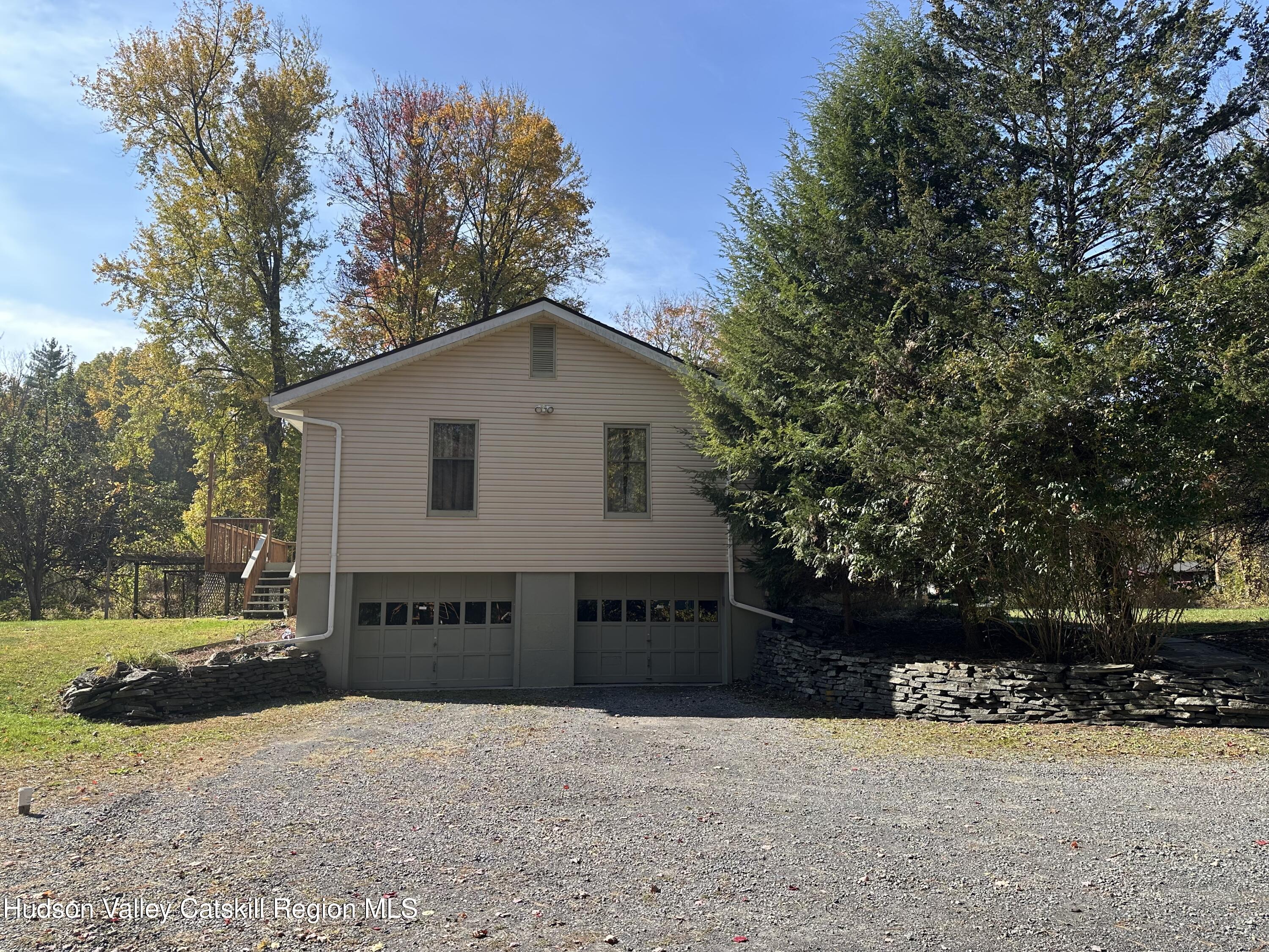 94 Tanglewood Road West Hurley, NY 12491 - Photo 25 of 34 a front view of a house with a yard