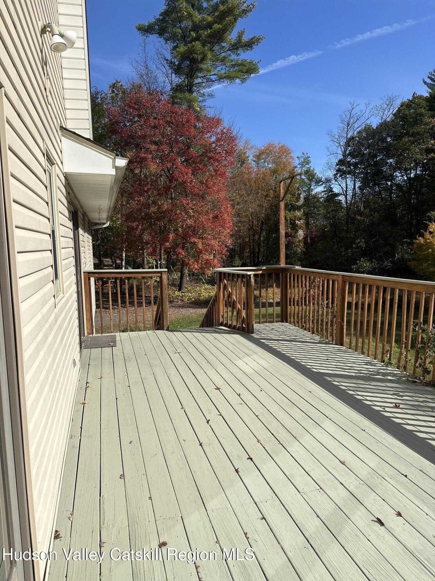 94 Tanglewood Road West Hurley, NY 12491 - Photo 29 of 34 a view of outdoor space with deck and yard