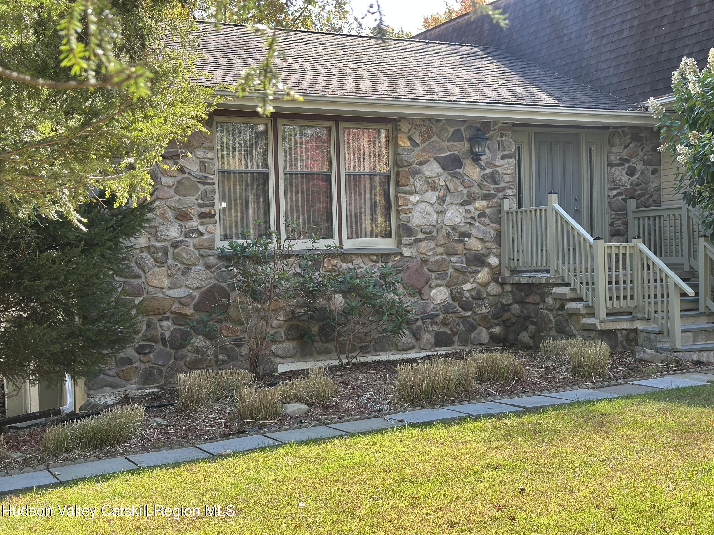 94 Tanglewood Road West Hurley, NY 12491 - Photo 30 of 34 a front view of a house with a yard