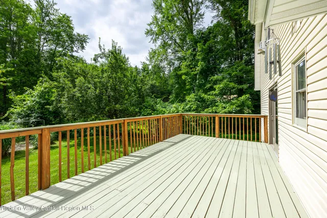 a balcony with trees in front of it