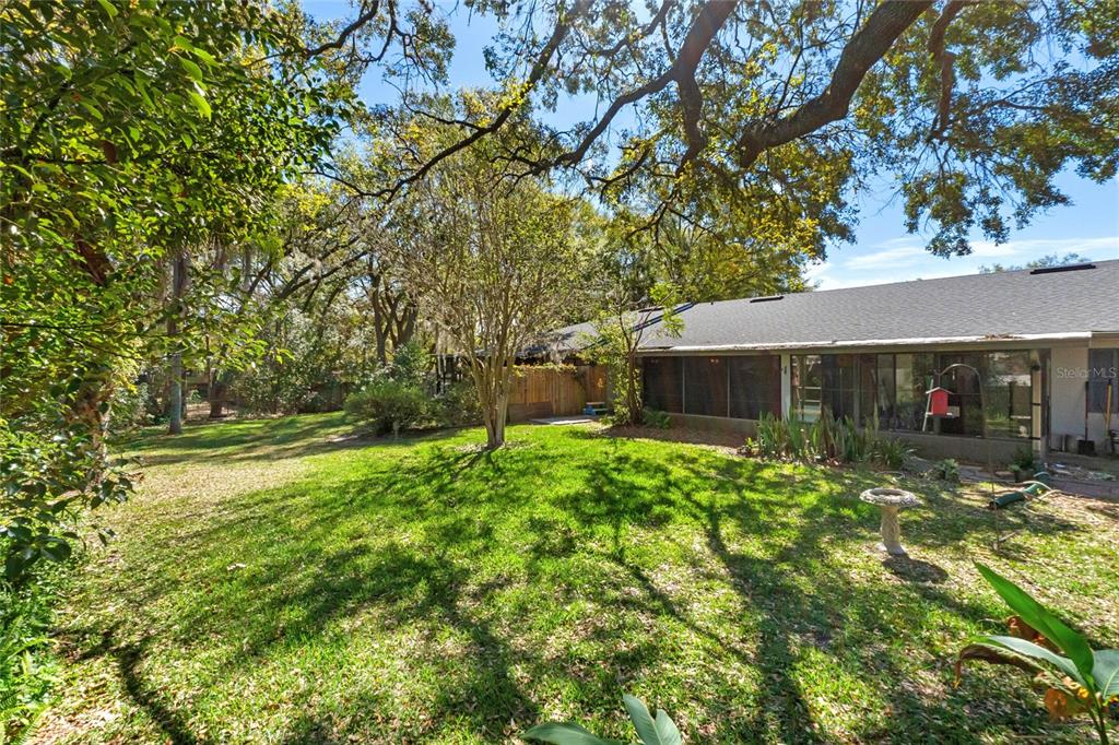 2723 Beacon Street Eustis, FL 32726 - Photo 26 of 42 a front view of a house with a yard